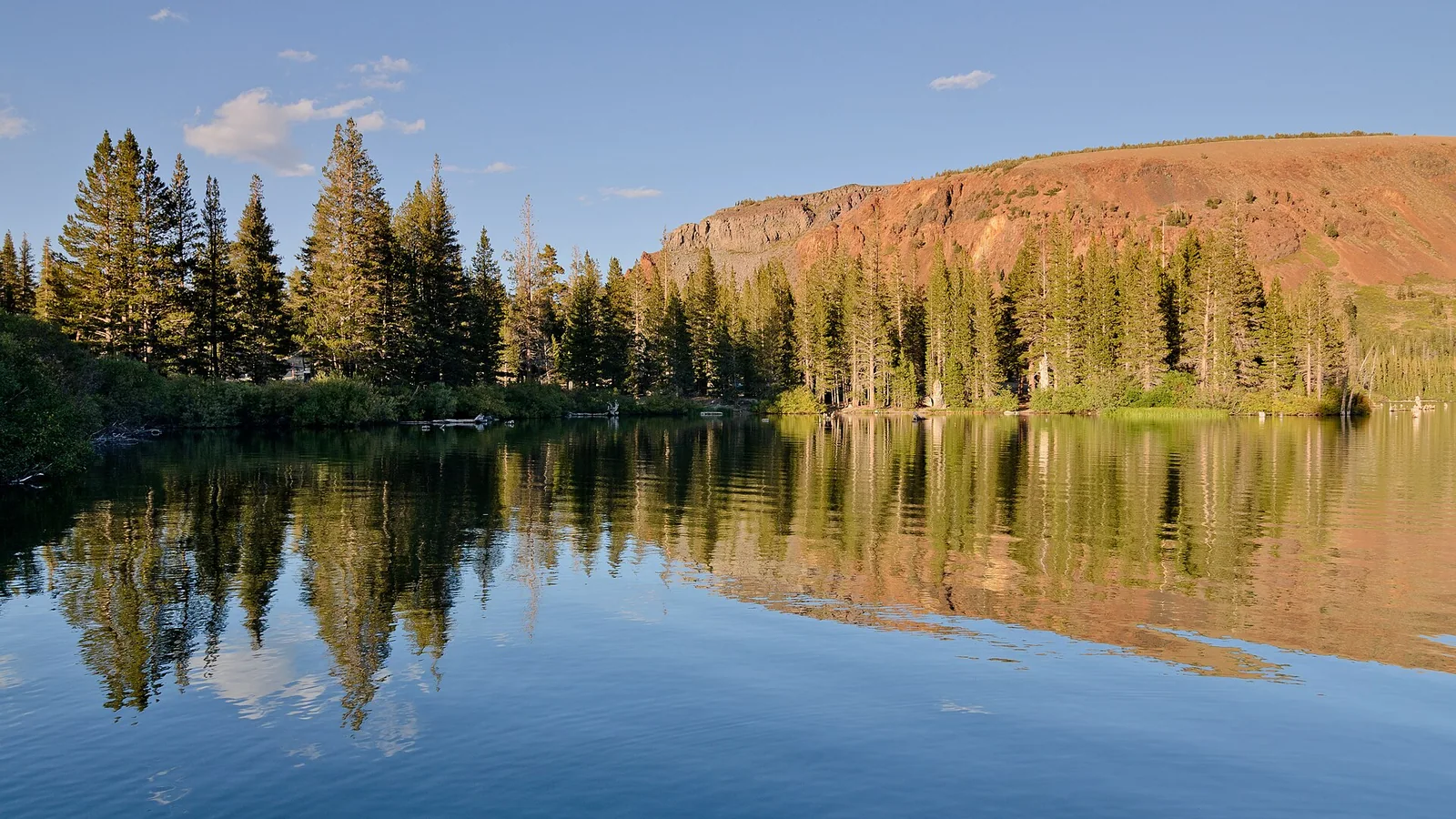 Lake Mary in the Mammoth Lakes Basin beneath a pine-covered slope.